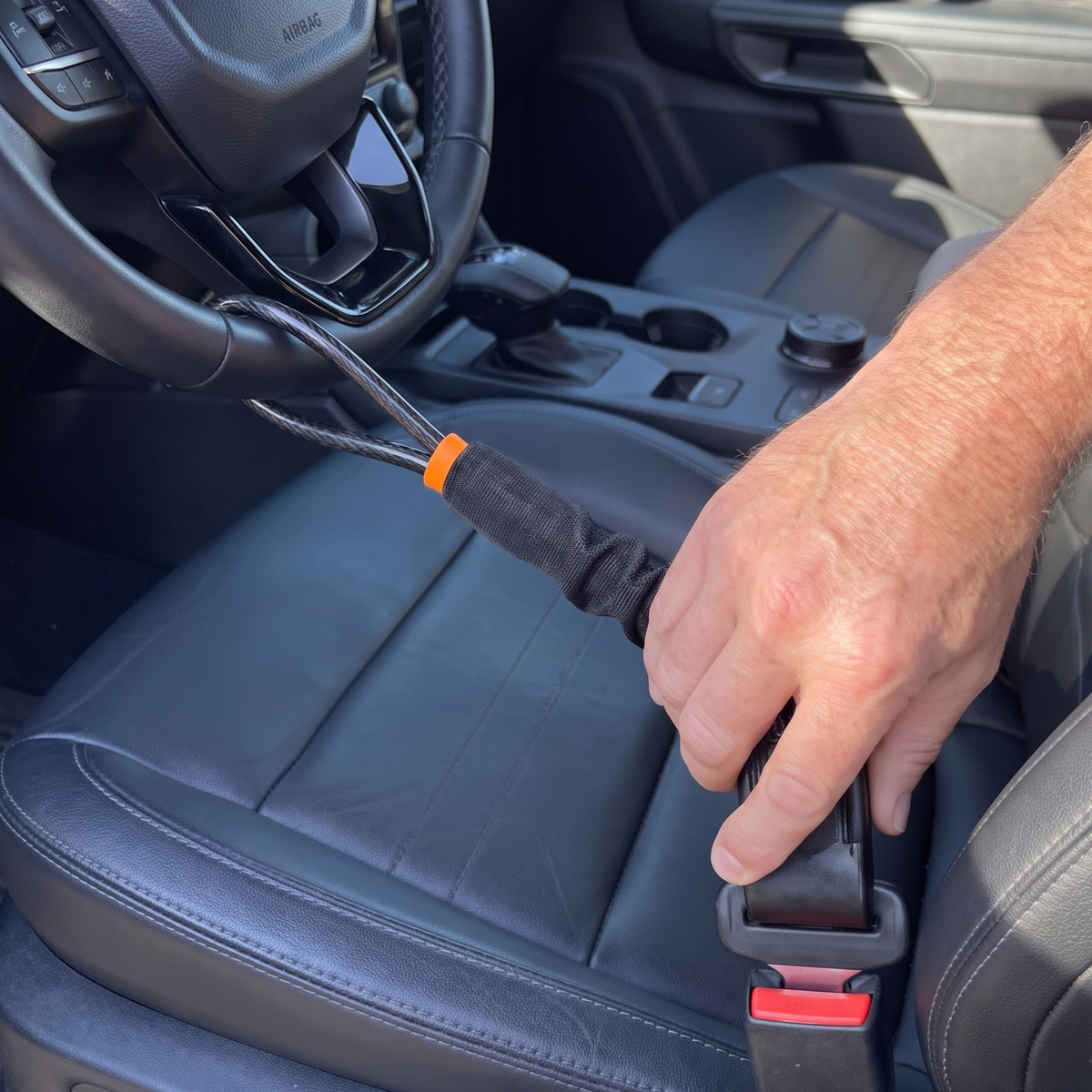 Clicking the NoTheft lock into the driver seatbelt buckle